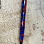 Slim Line Pen with patriotic acrylic body<br>Sherry & Jay Phillips<br><a href="http://www.jsturnings.com" target="_blank" rel="noopener">jsturnings.com</a>